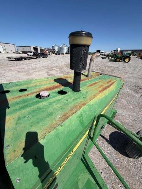  John Deere 4995 Self-Propelled Windrowers and Swather
