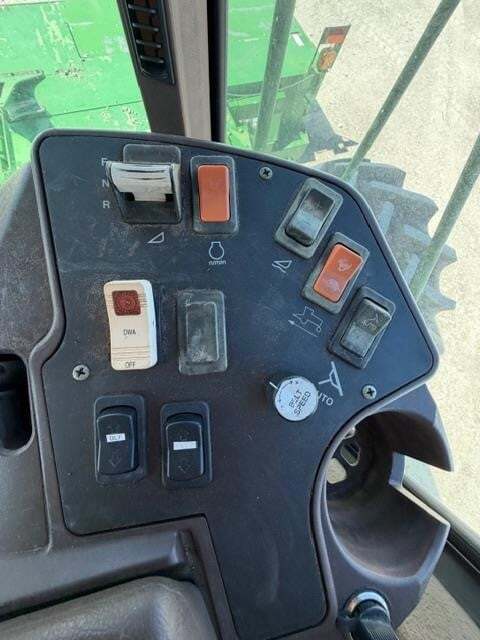  John Deere 4995 Self-Propelled Windrowers and Swather