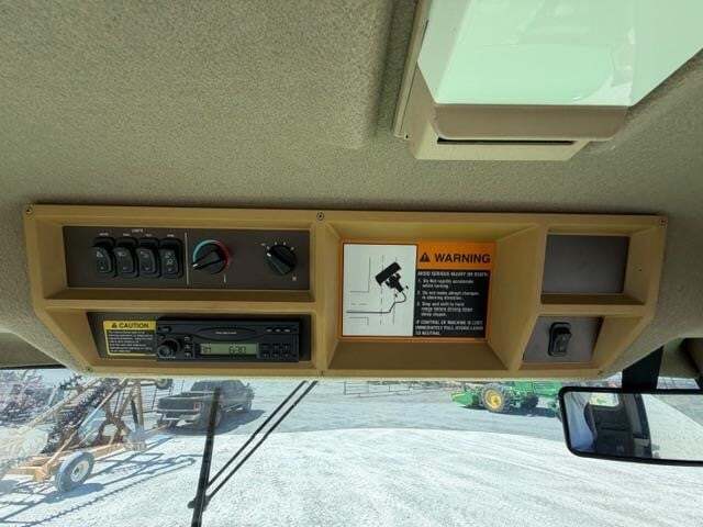  John Deere 4995 Self-Propelled Windrowers and Swather