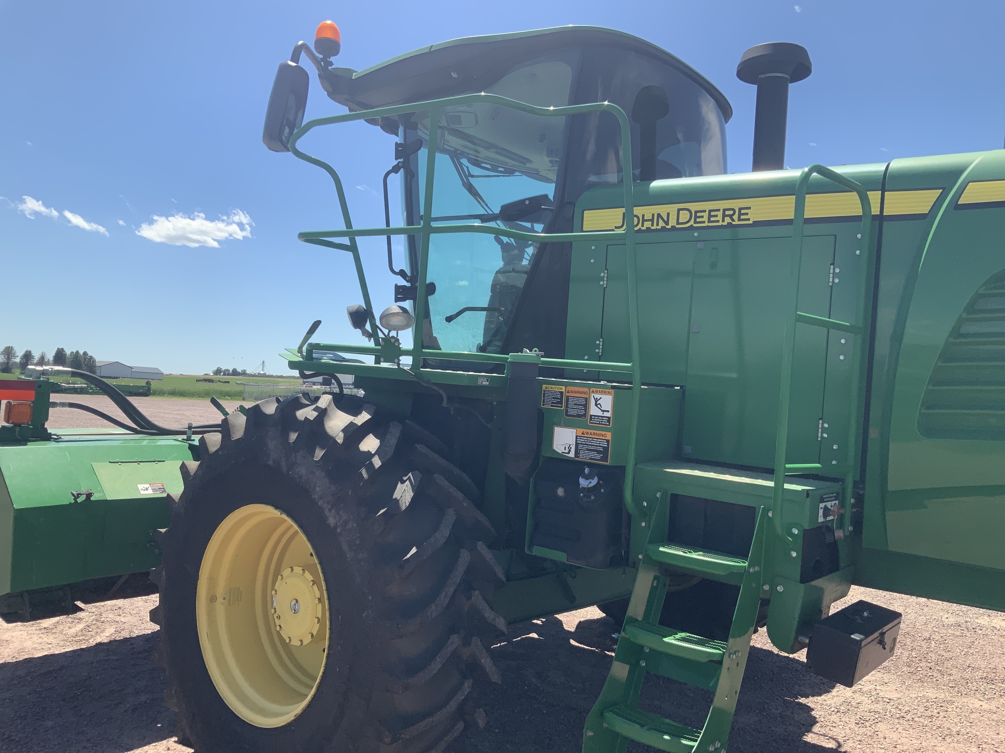 2014 John Deere W235 Self-Propelled Windrowers and Swather