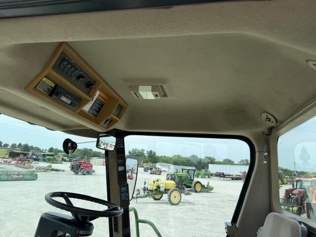  John Deere 4995 Self-Propelled Windrowers and Swather
