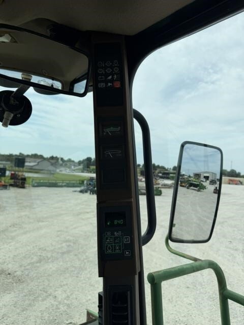  John Deere 4995 Self-Propelled Windrowers and Swather