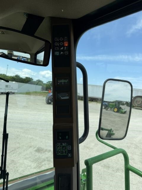  John Deere 4995 Self-Propelled Windrowers and Swather