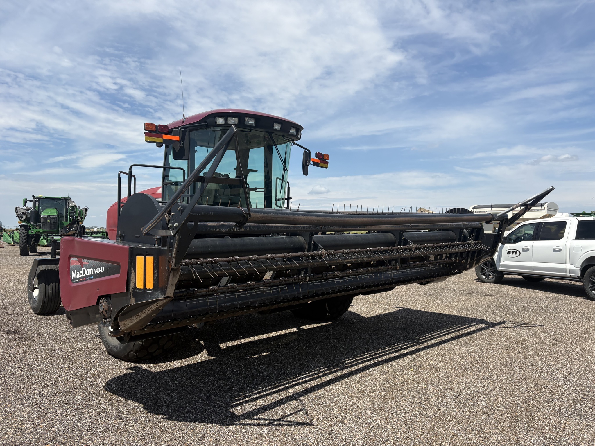 2010 MacDon M150 Self-Propelled Windrowers and Swather