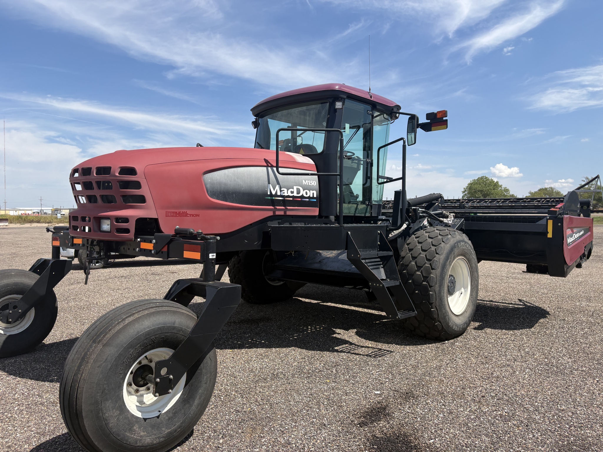 2010 MacDon M150 Self-Propelled Windrowers and Swather