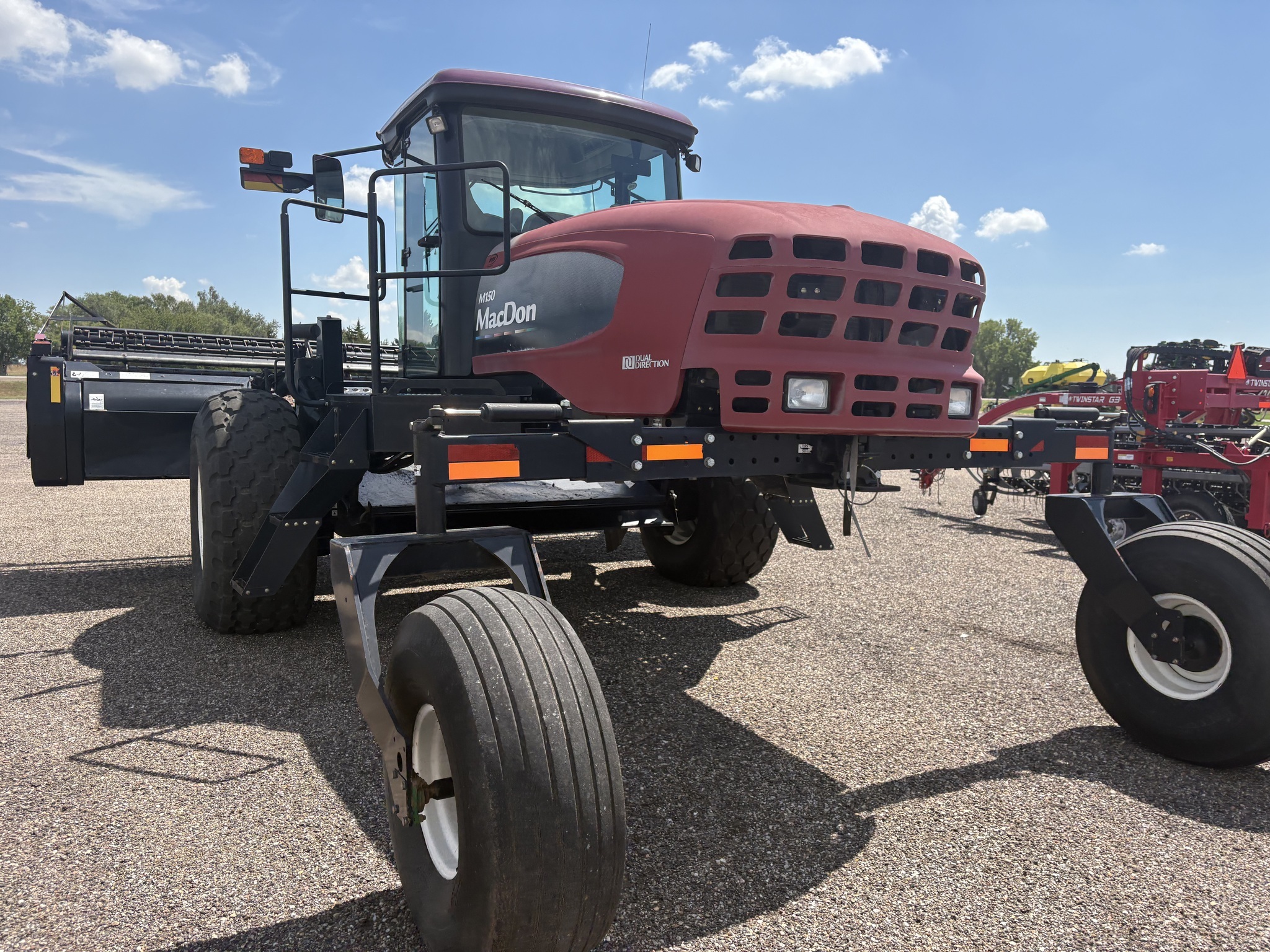 2010 MacDon M150 Self-Propelled Windrowers and Swather